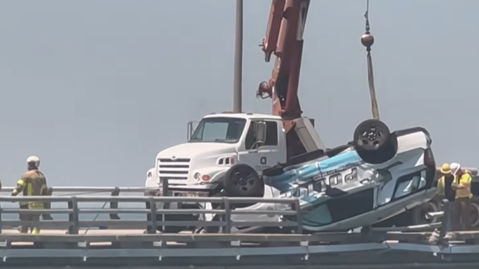 Va. cruiser dangles over bridge ledge after flipping during crash